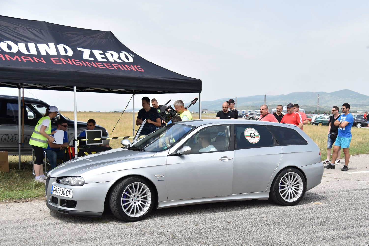 Silver sporty wagon with multi-spoke alloy wheels and lowered stance