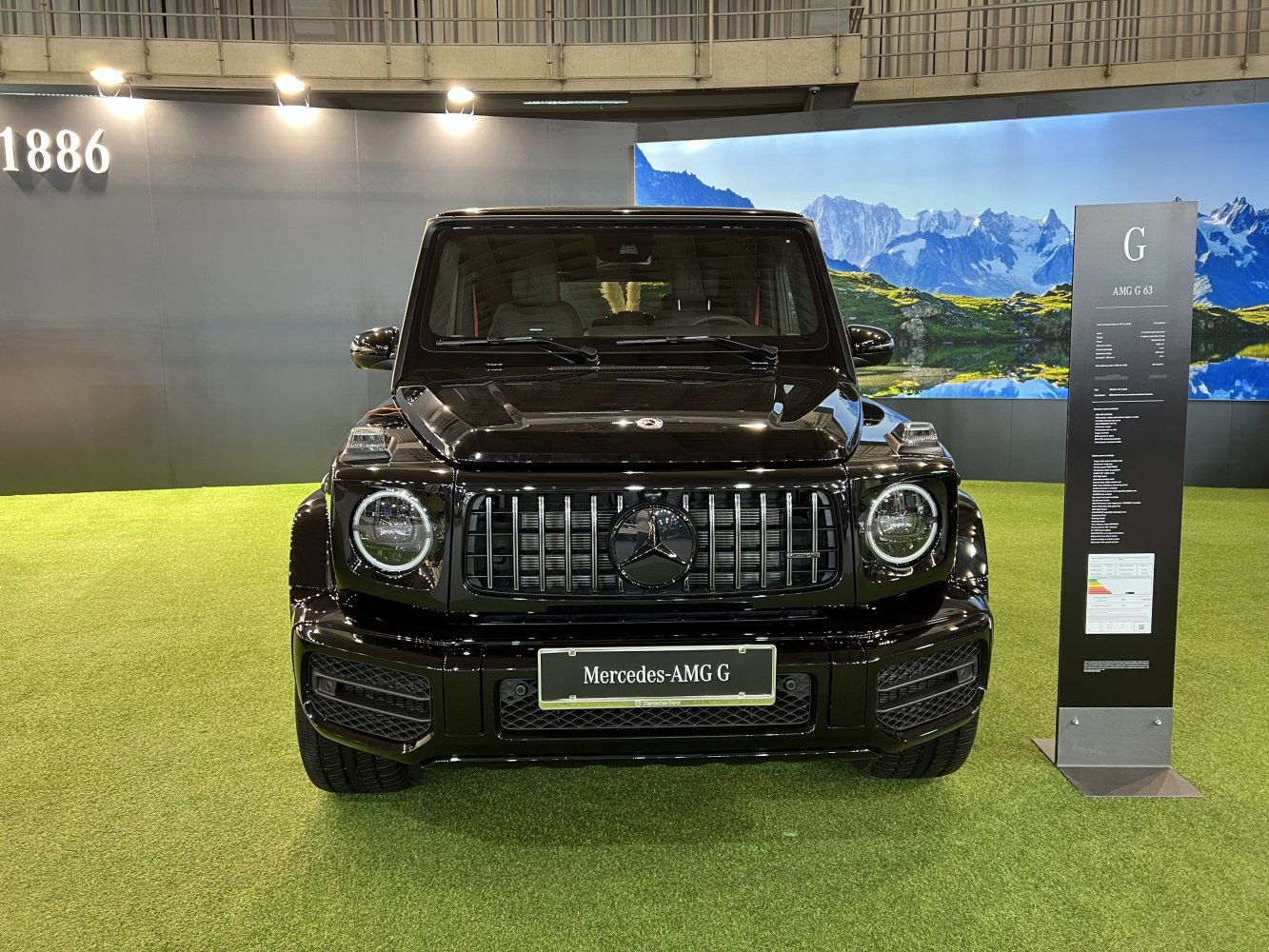 Front view with vertical grille bars and round LED headlights