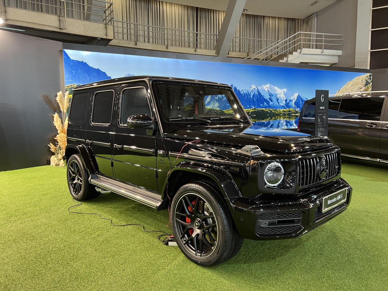Black luxury SUV with AMG styling and distinctive alloy wheels