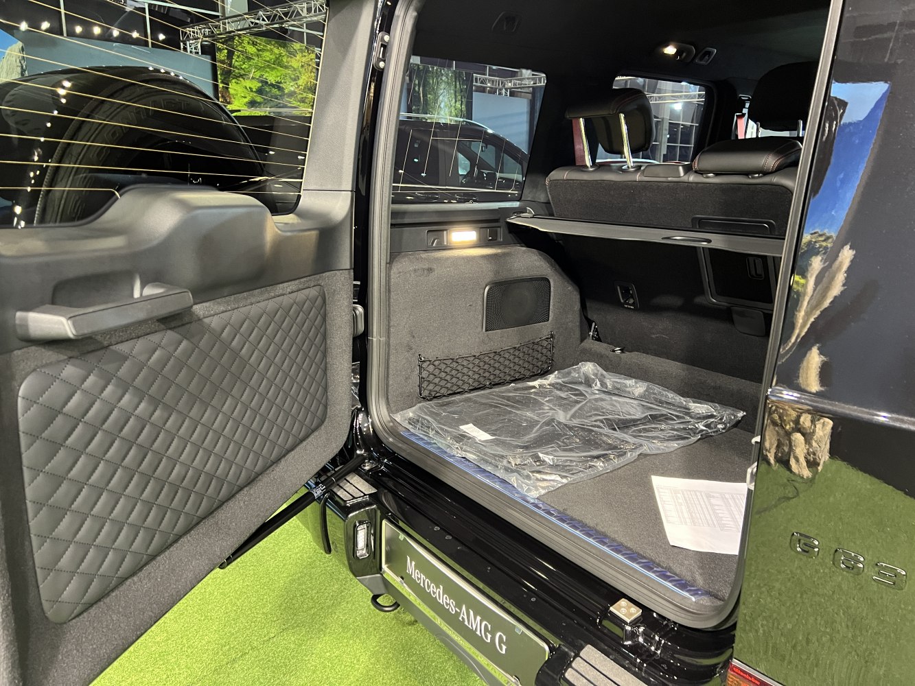 Quilted door panel and spacious rear cargo compartment with foldable covers