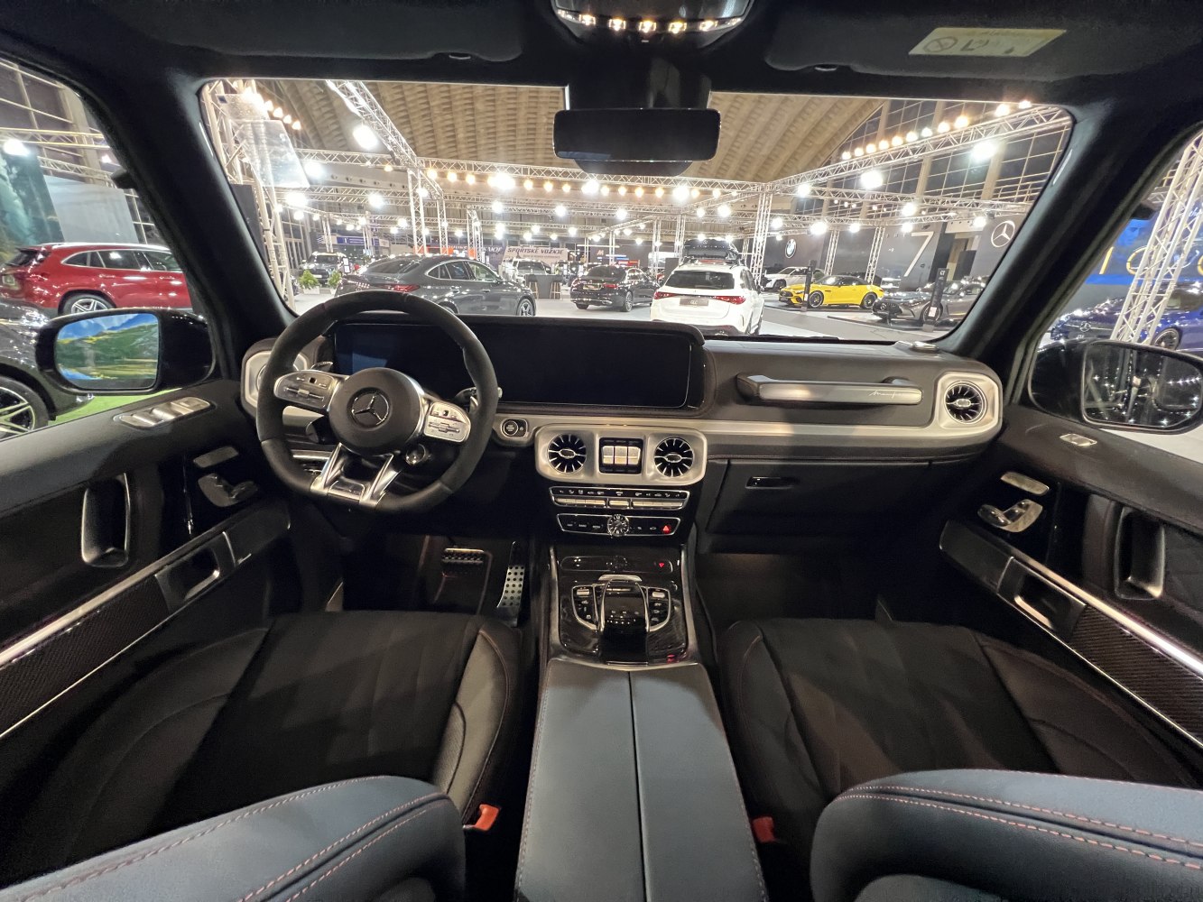 Modern luxury SUV interior with advanced dashboard and steering wheel