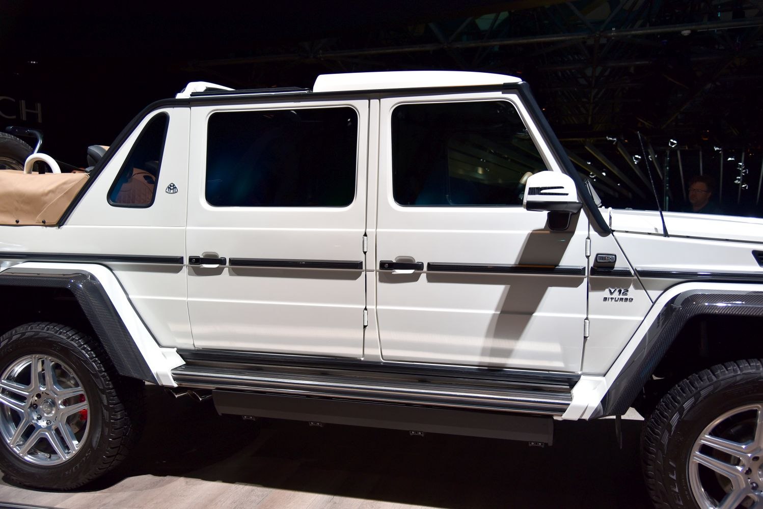 Side profile of luxury SUV with V12 Biturbo badge and distinctive design