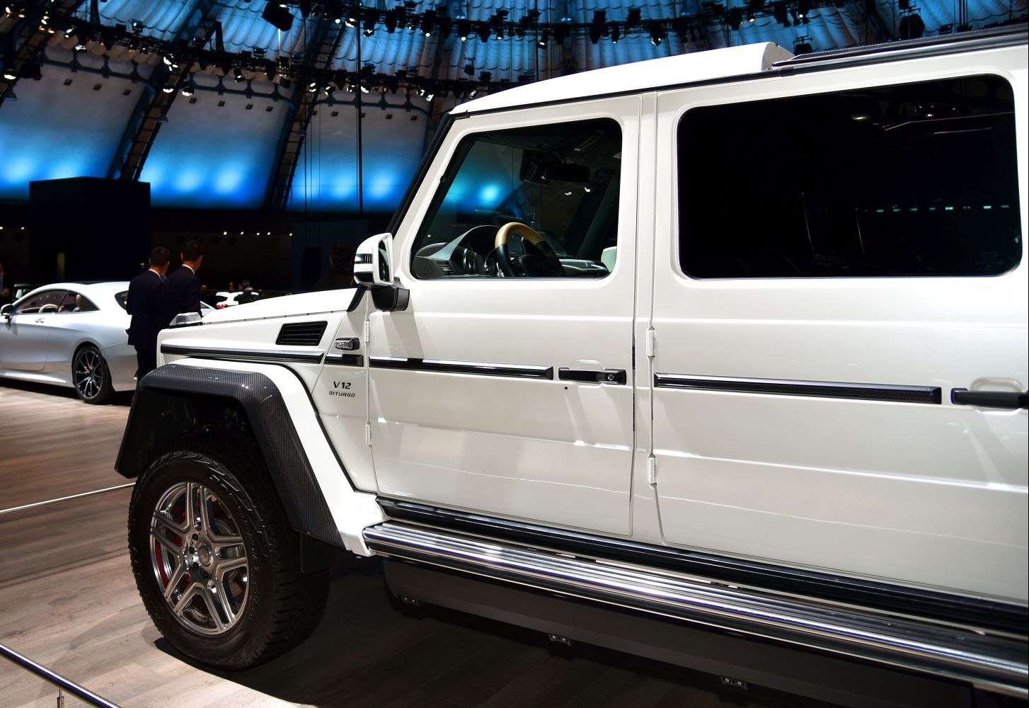 Side profile with V12 Biturbo badge and carbon fiber front fender