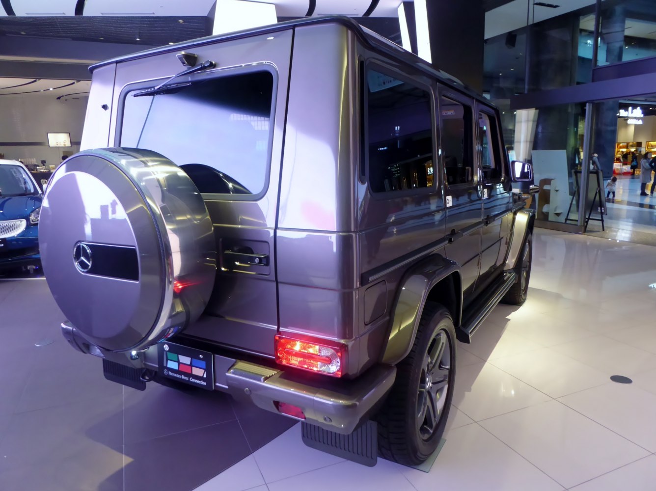 Rear view of SUV with spare wheel cover and rear taillights