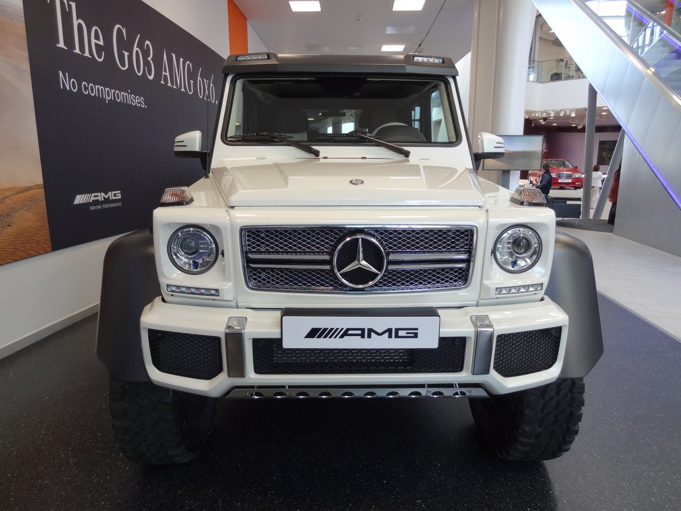 Front view with grille, headlights and rugged fenders.