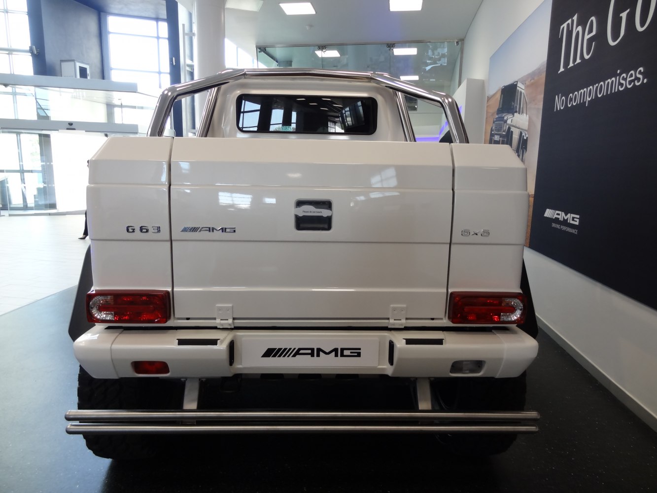 Rear view of six-wheel-drive luxury SUV with AMG branding