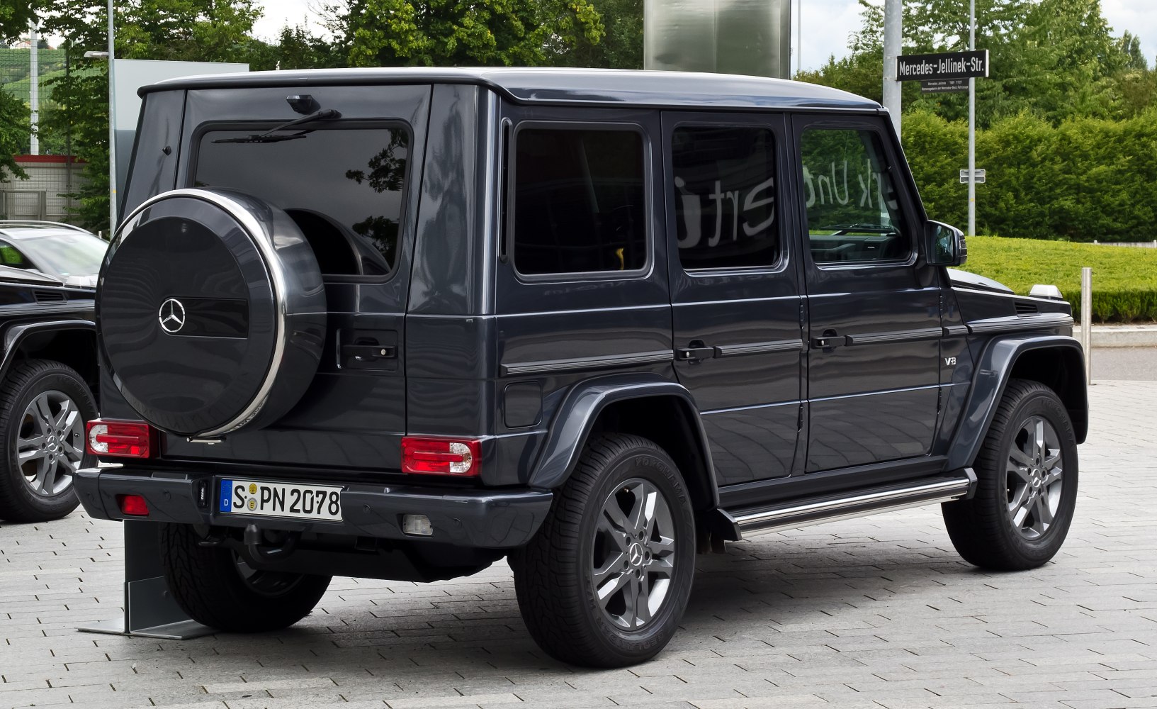 Rear side view with spare tire cover and tinted windows