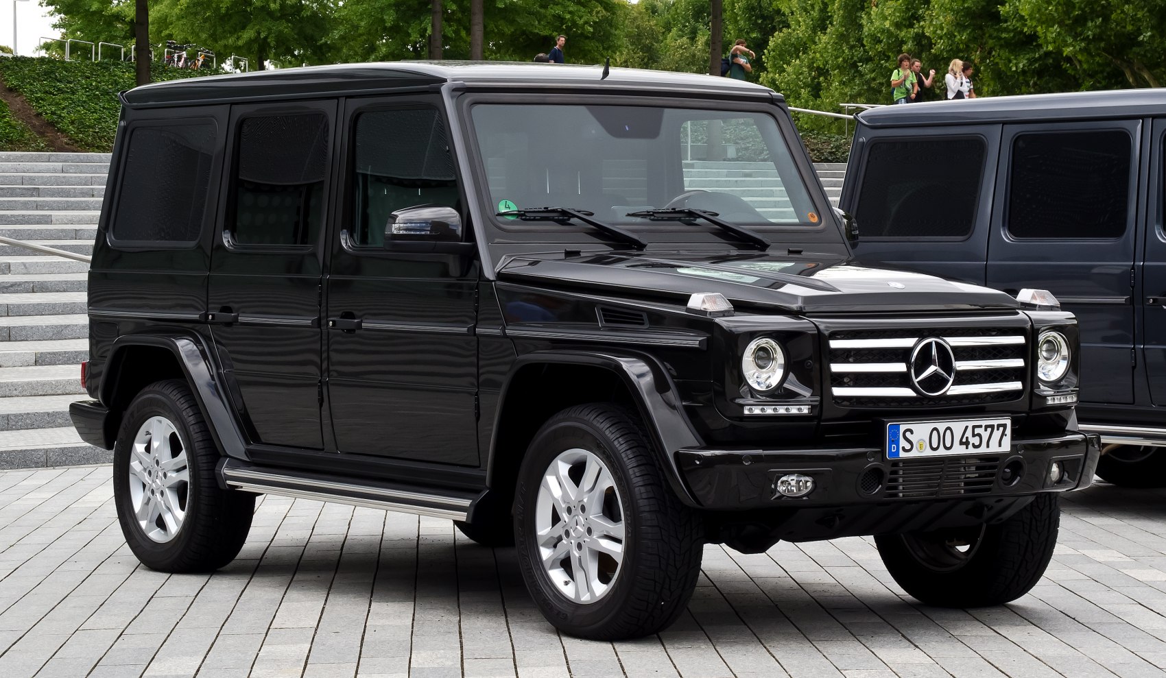 Boxy SUV with round headlights and long wheelbase side profile