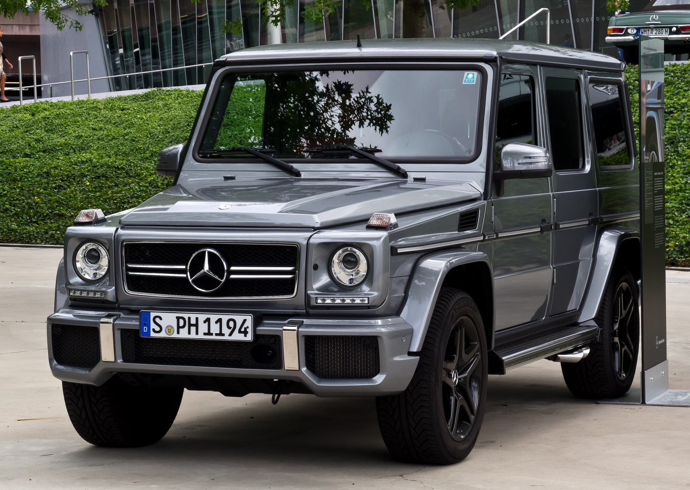 Robust front and side view of a luxury off-road SUV with distinctive round headlights