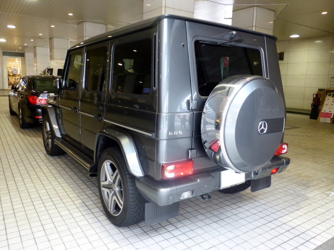 Rear spare tire cover and prominent tail lights on a luxury SUV