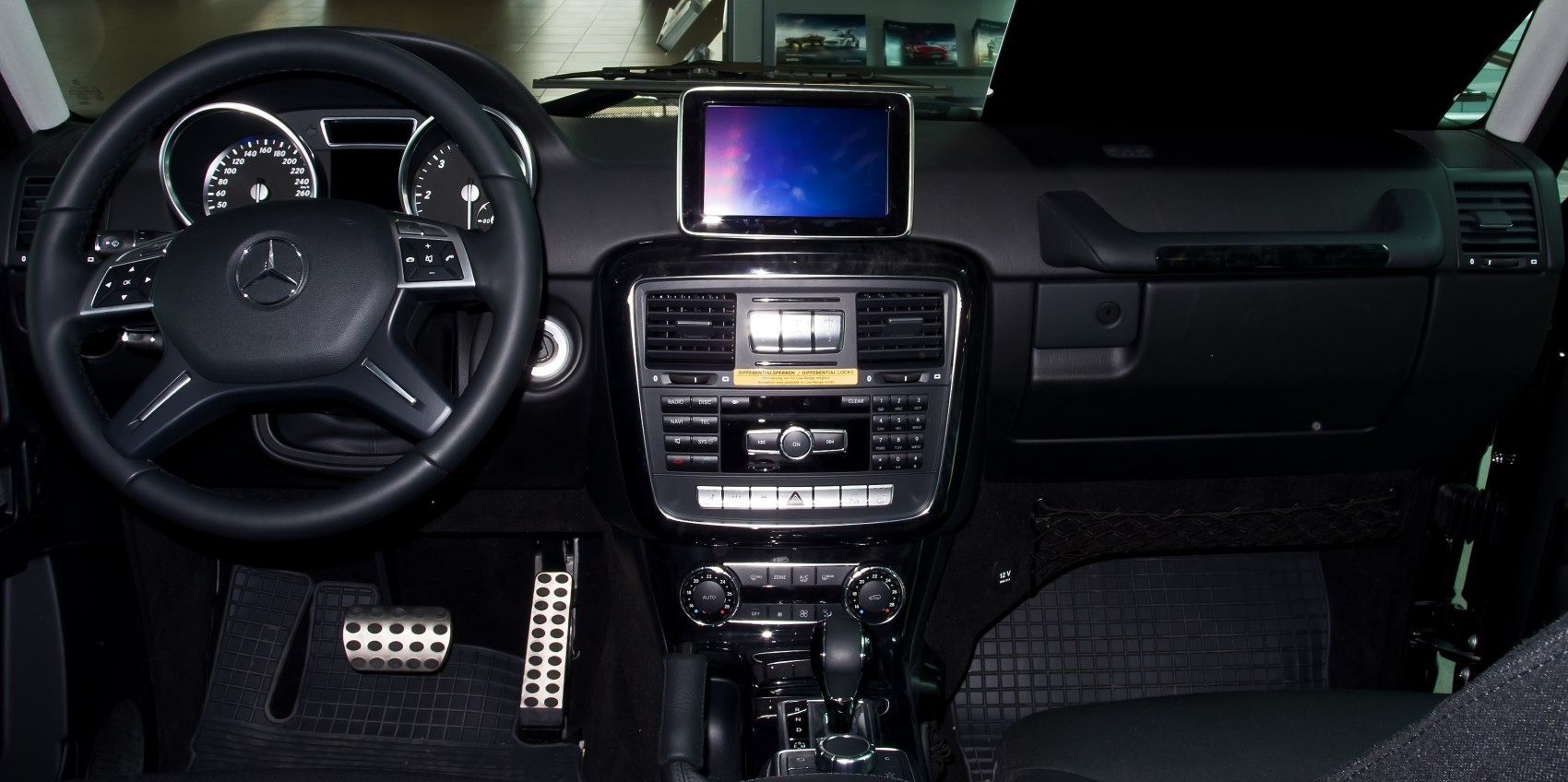 Steering wheel, dashboard, infotainment screen, control panel, climate control dials