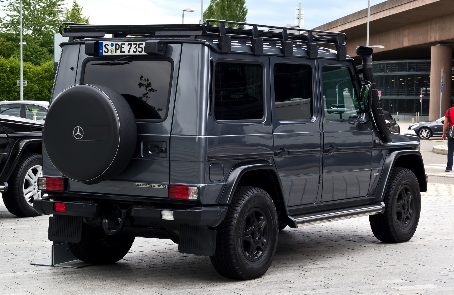 Rear view of rugged off-road SUV with roof rack and snorkel