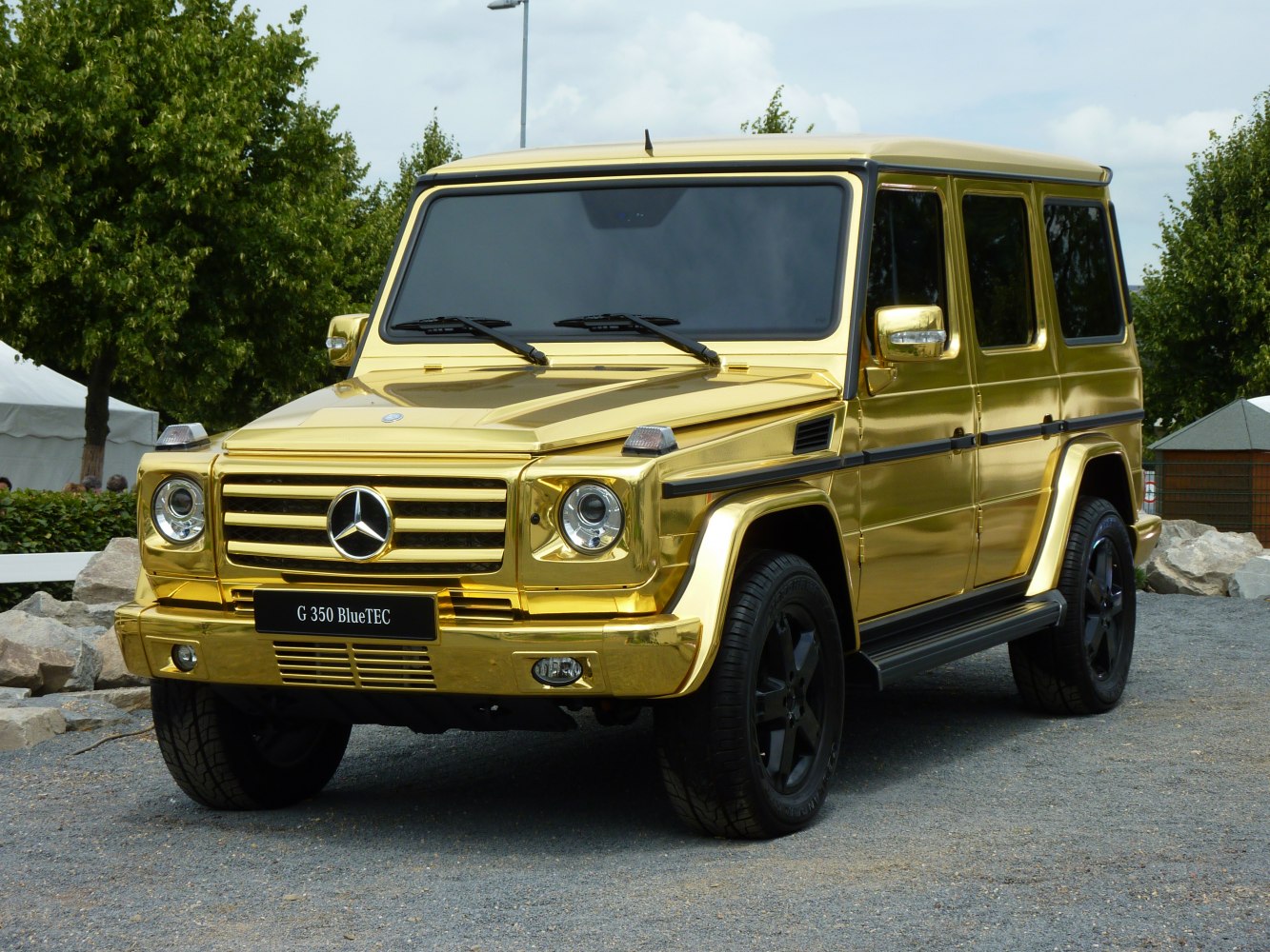 Gold chrome exterior SUV with black wheels and tinted windows