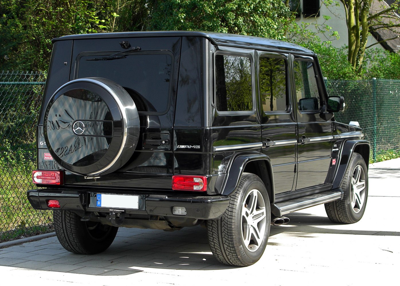 Rear view with spare tire cover and distinctive AMG badging