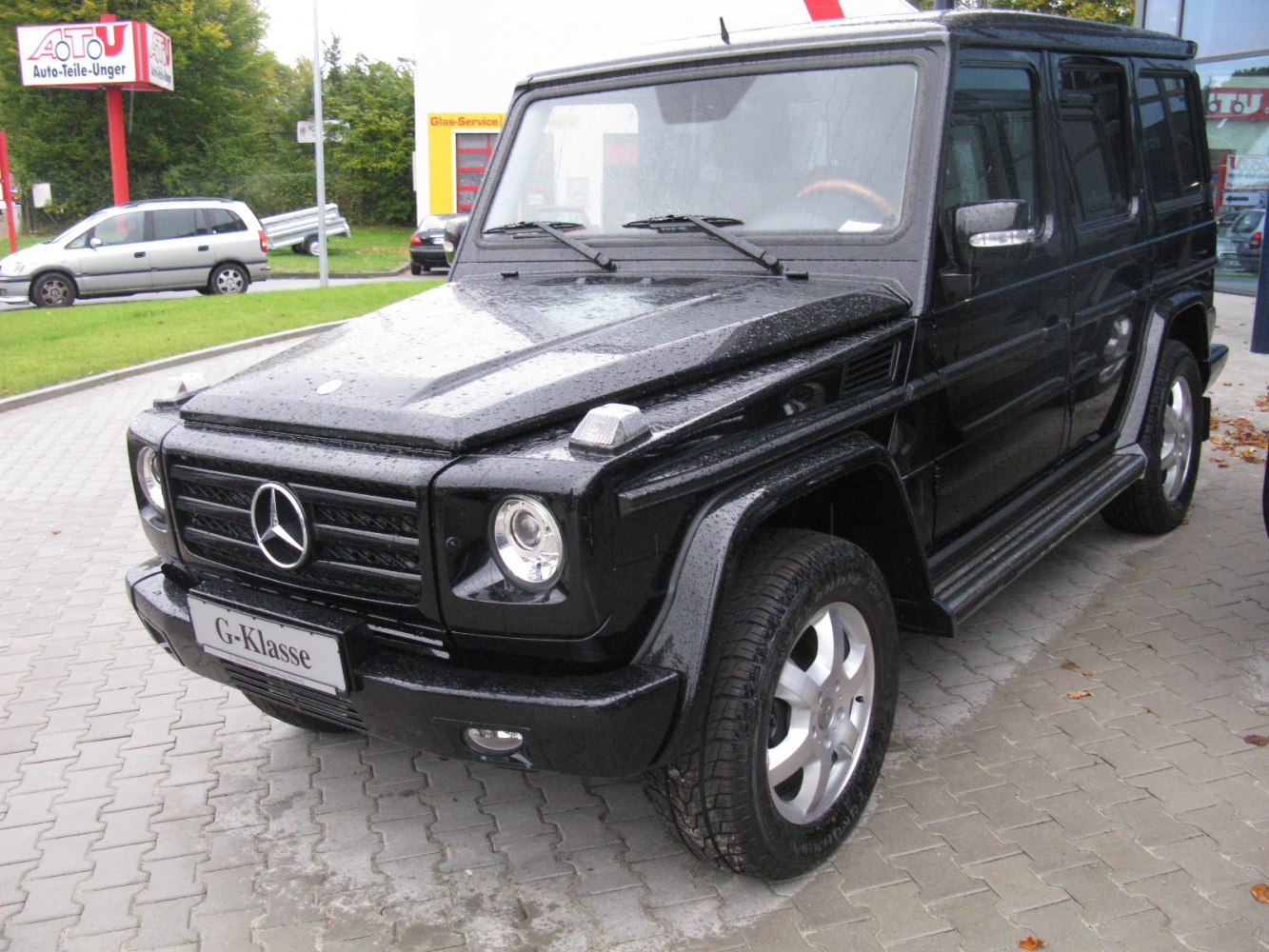 Black boxy SUV with distinctive grille and round headlights.