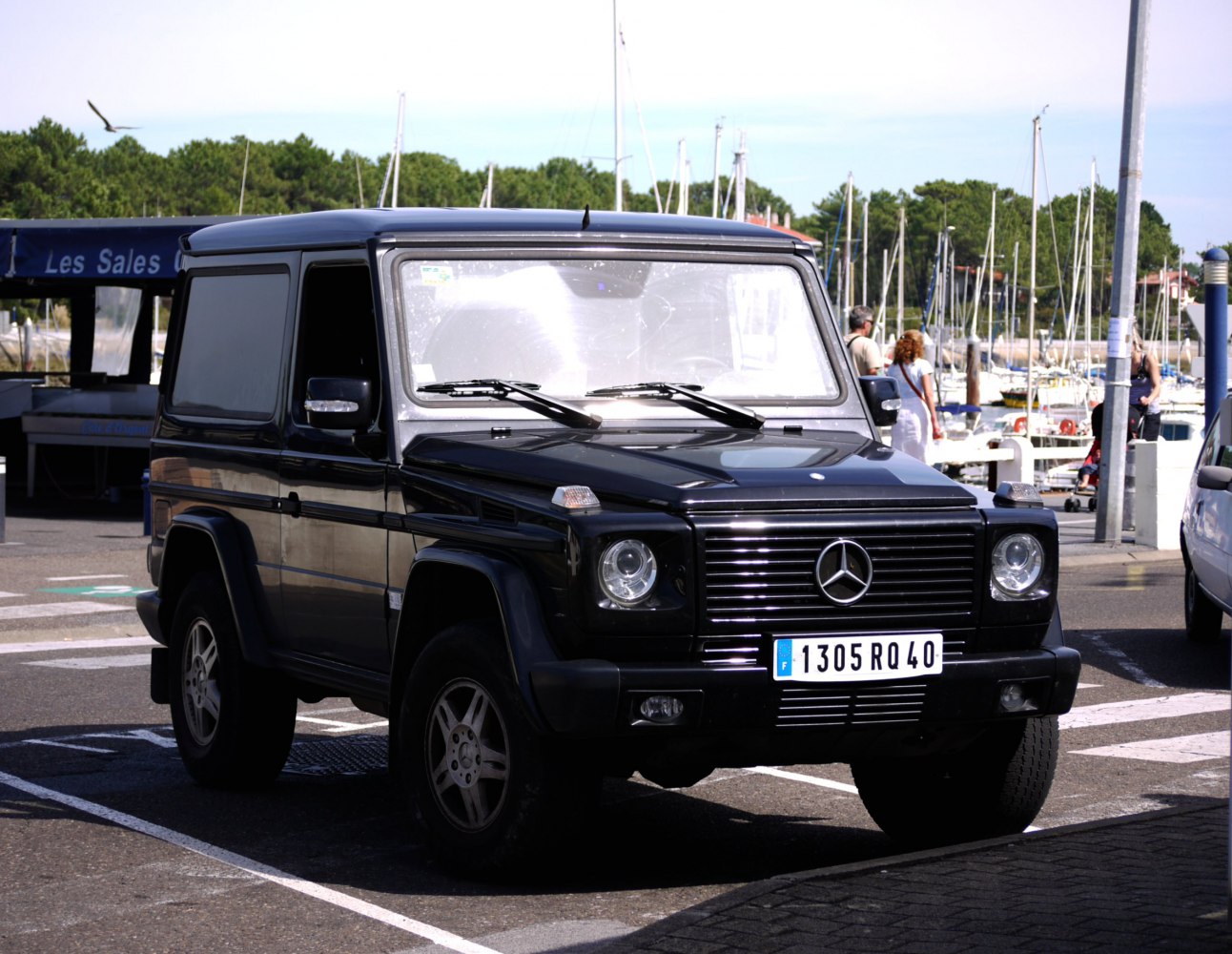 Front view of black SUV with iconic grille and round headlights