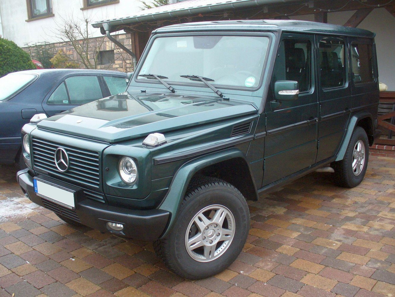 Boxy off-road SUV front and side view with all-terrain tires and rugged design