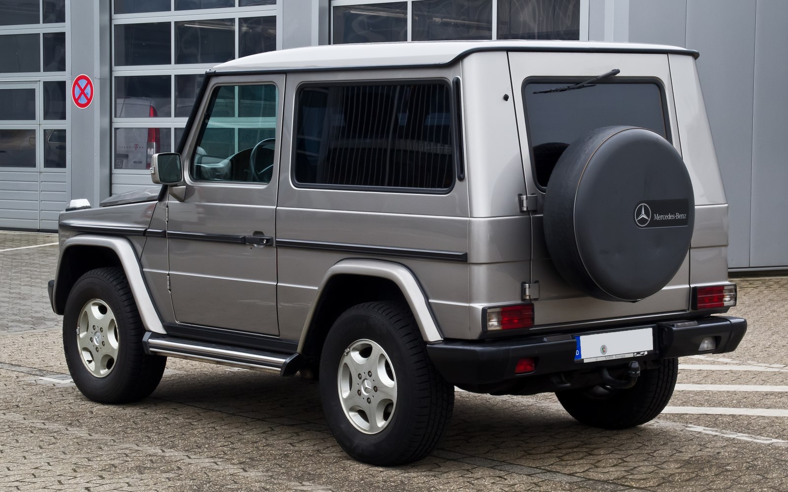 Rear side view of SUV with spare wheel cover