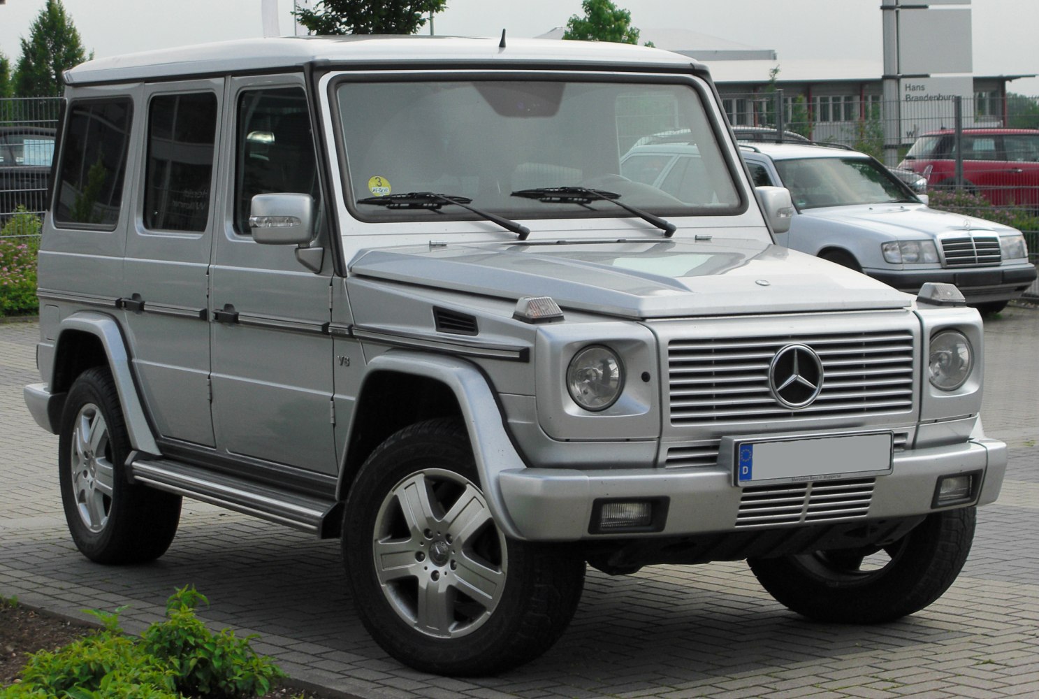 Boxy SUV with front grille and round headlights