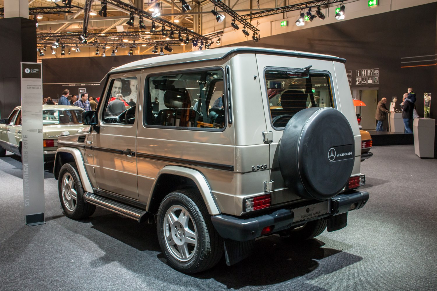 Rear side of boxy SUV with mounted spare tire and rear wiper
