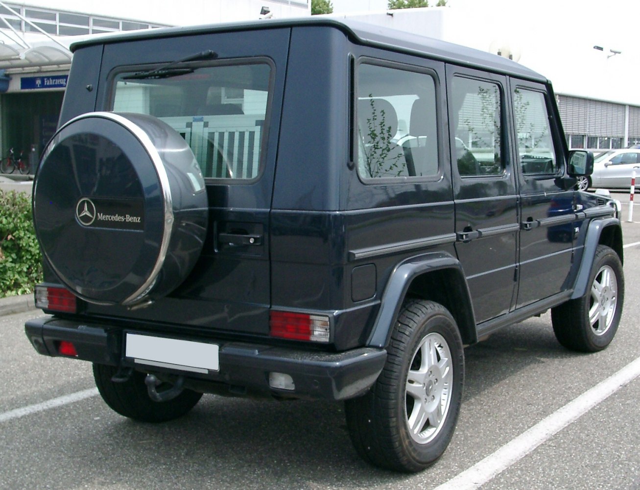 Rear side with spare tire cover and boxy SUV profile