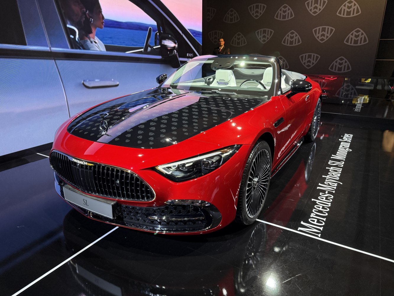 Luxury convertible with black patterned hood and LED headlights