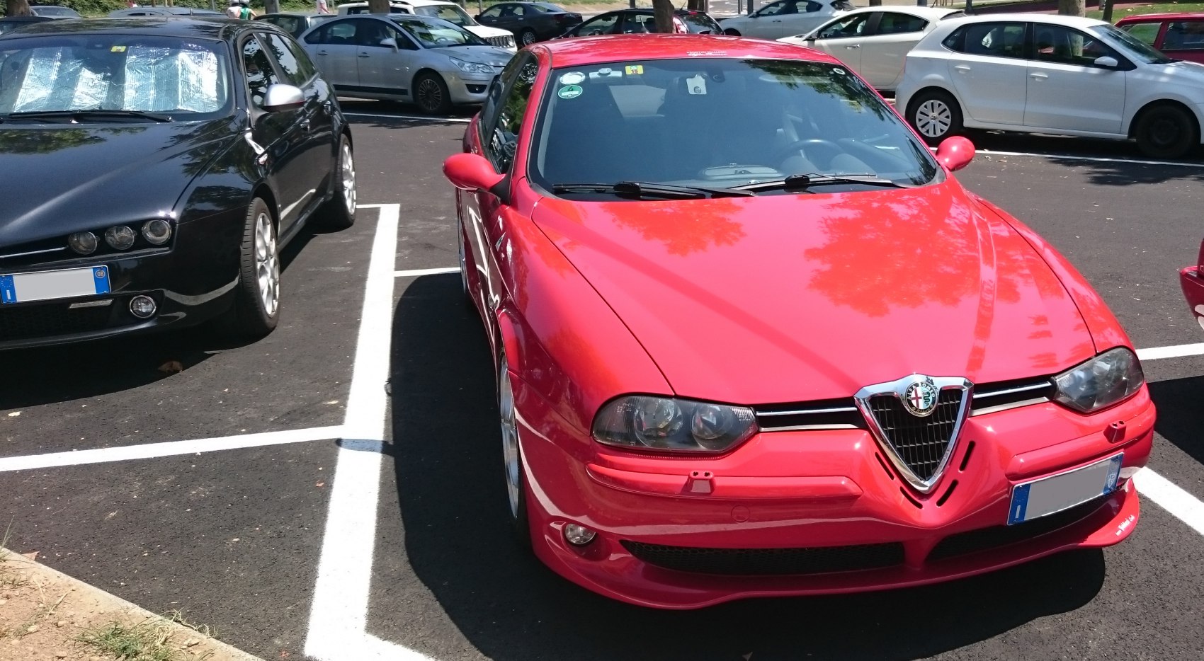 Sporty front view with sharp headlights and iconic grille
