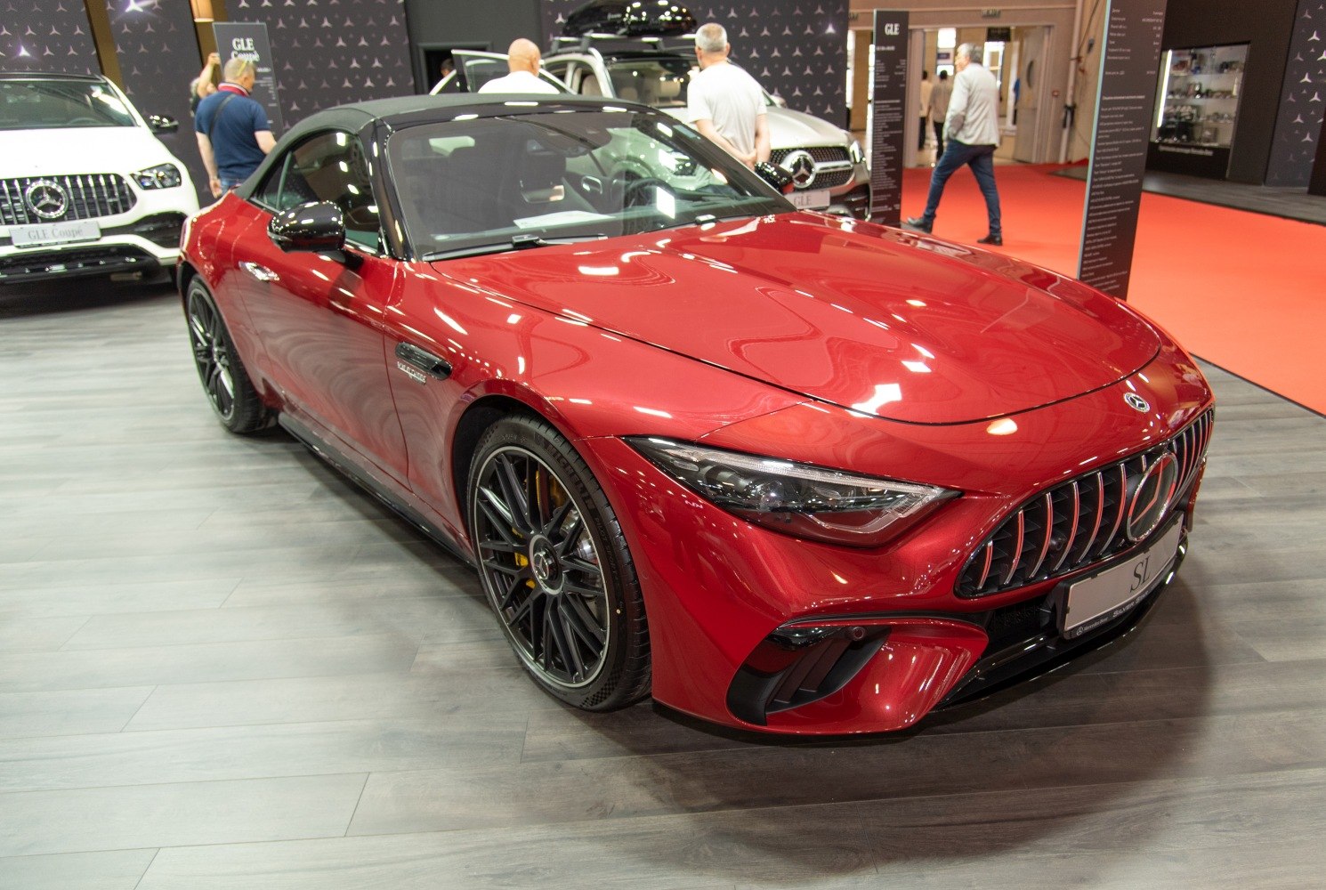 Sporty red convertible with black wheels and LED headlights