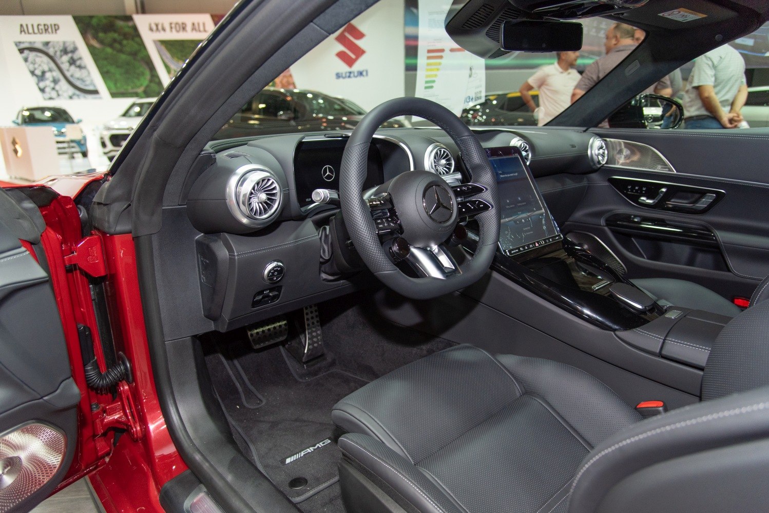 Luxury car interior with digital displays and premium steering wheel
