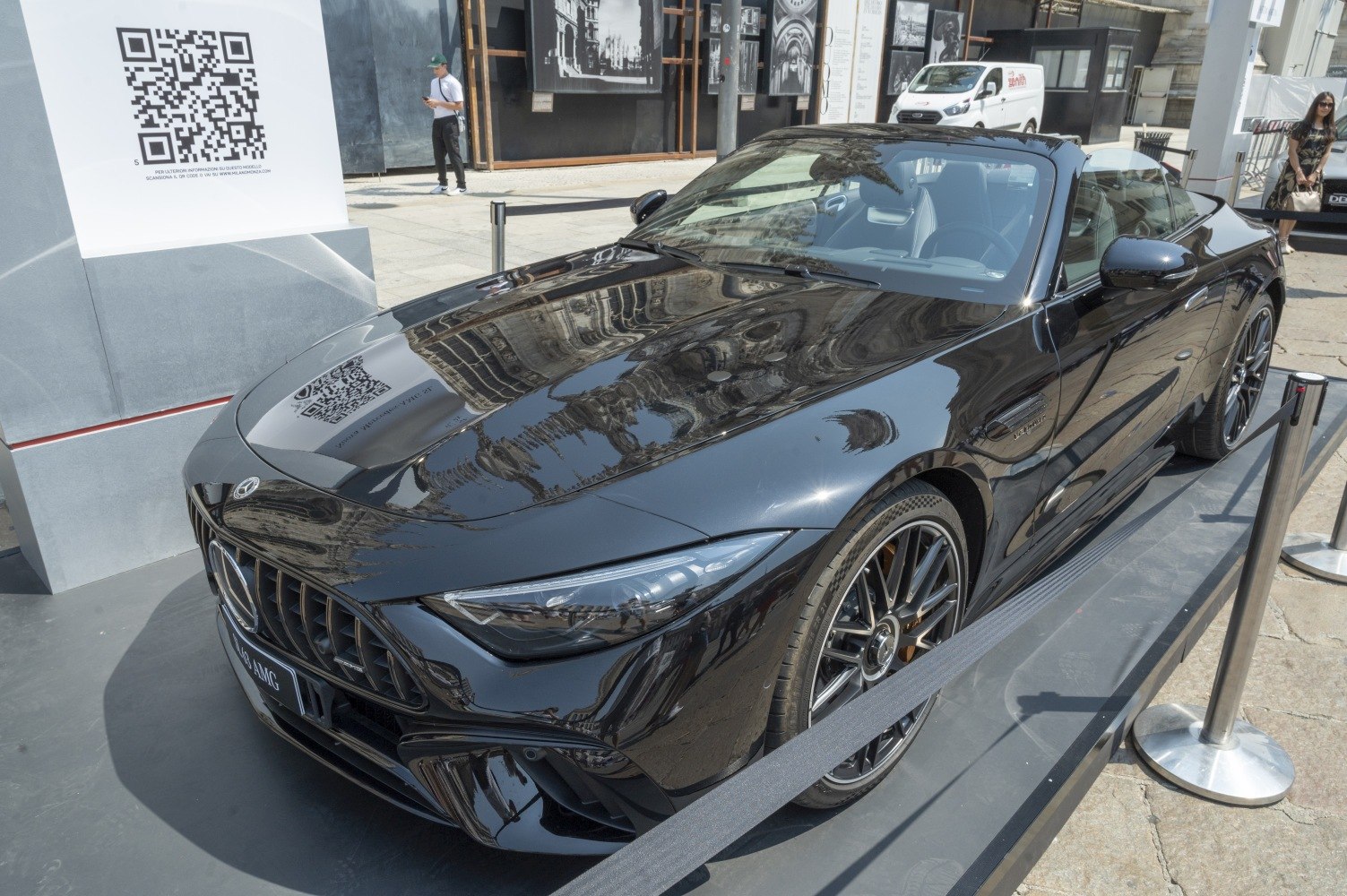 Sleek black convertible with aggressive front grille and sporty wheels
