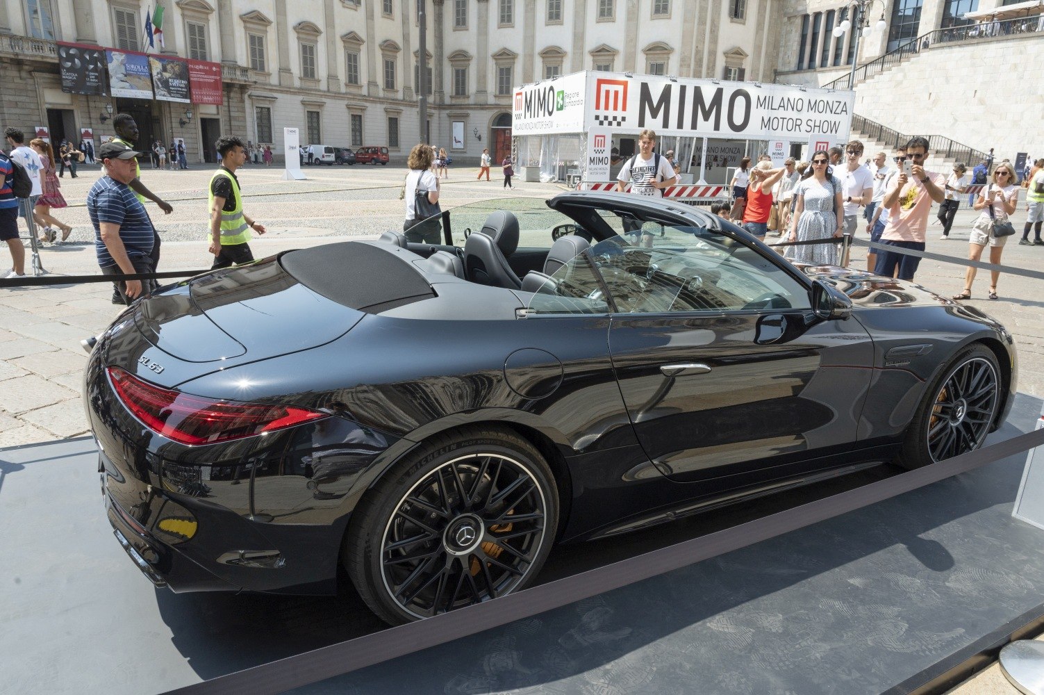 Black convertible sports car with black multi-spoke alloy wheels