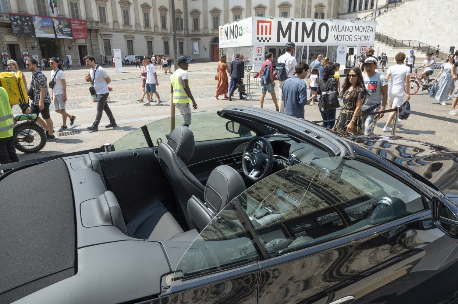 Convertible luxury roadster interior with open roof and premium seats