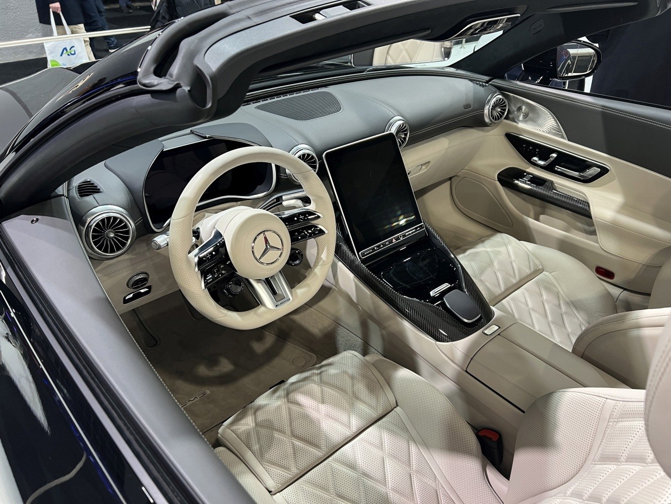 Luxury car interior with digital dashboard and cream leather seats