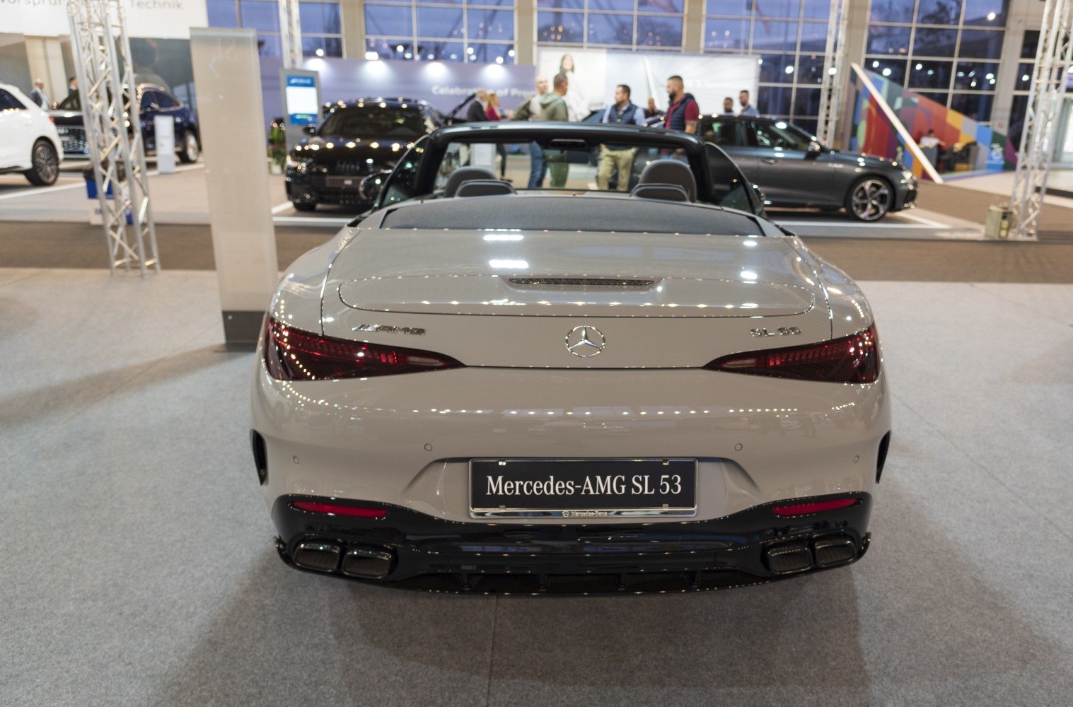 Convertible rear view with quad exhausts and sleek taillights