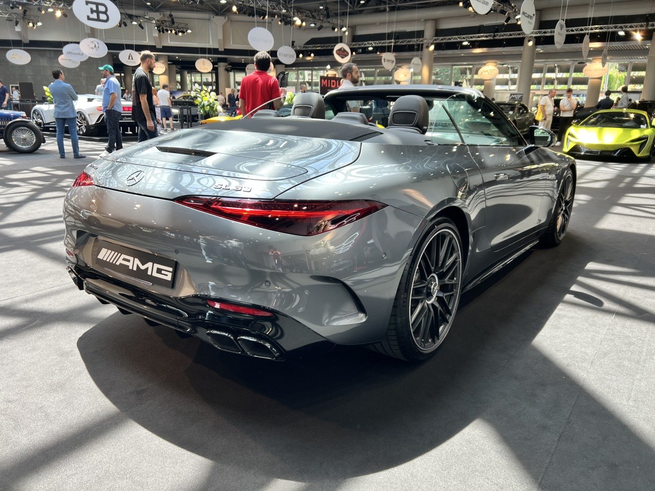 Rear view of luxury convertible with AMG quad exhaust and LED tail lights