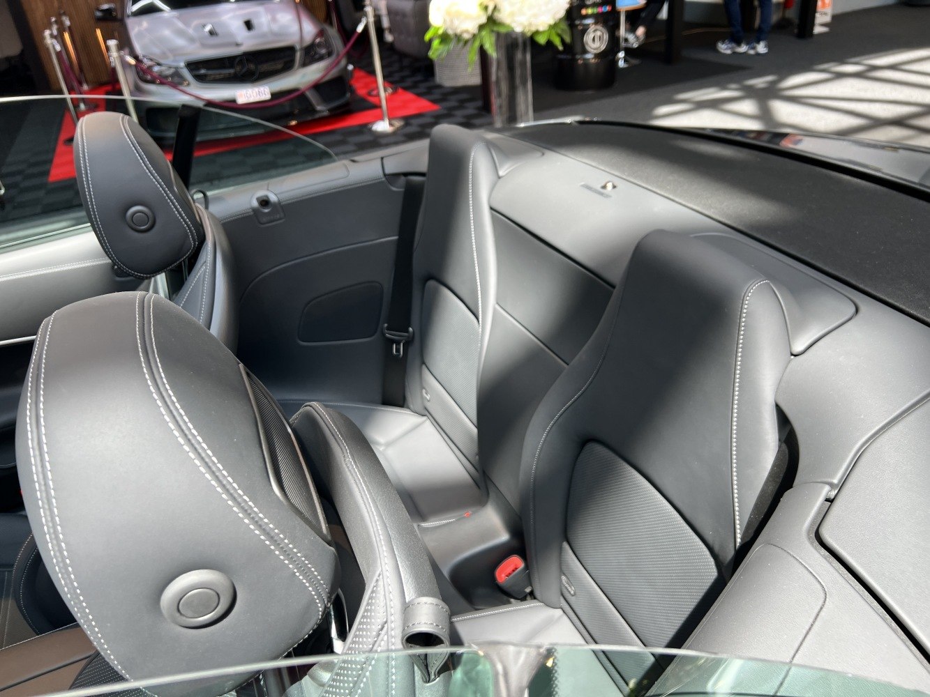 Black leather interior with sporty ergonomic seats and stitching