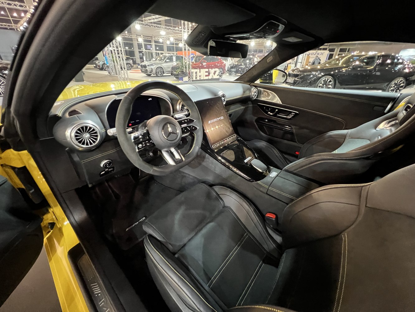 AMG sport seats and digital dashboard in a modern luxury car interior