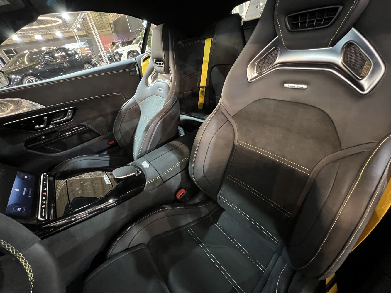 AMG sport seats with yellow stitching and sleek center console