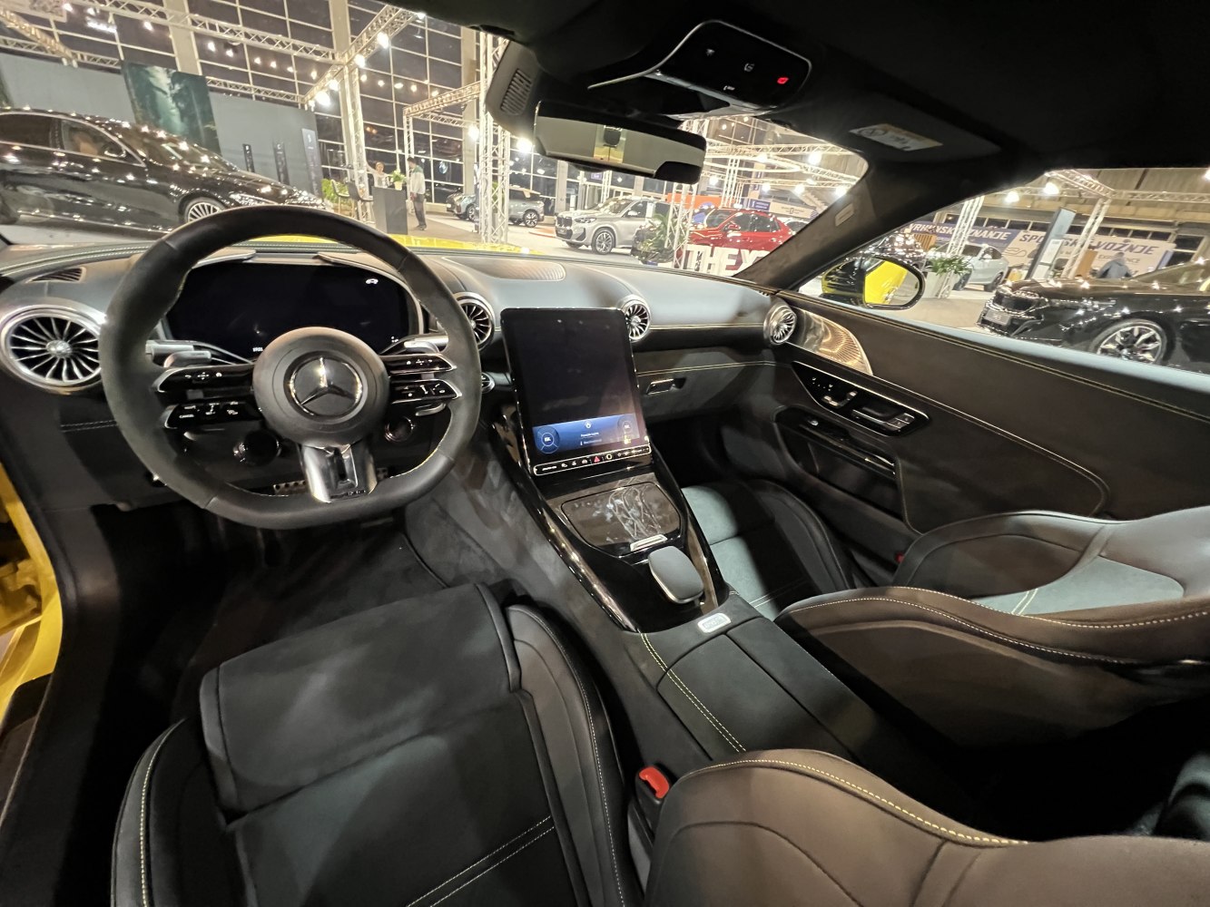 Digital cockpit, vertical infotainment screen, and premium interior design.