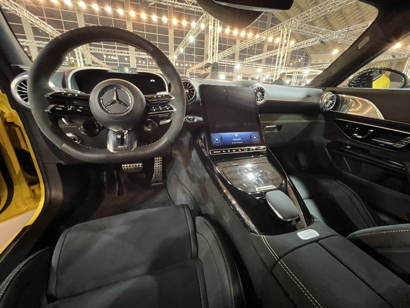 Digital instrument cluster and central touchscreen in luxury car interior