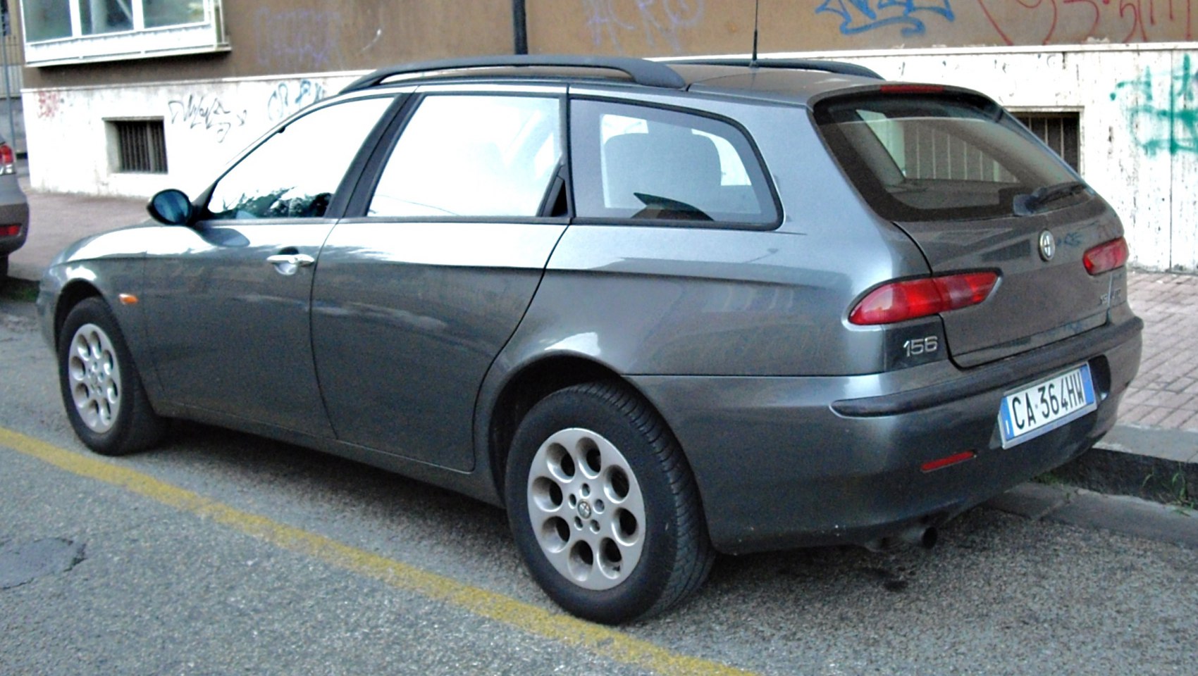 Rear side profile with roof rails and multi-hole alloy wheels