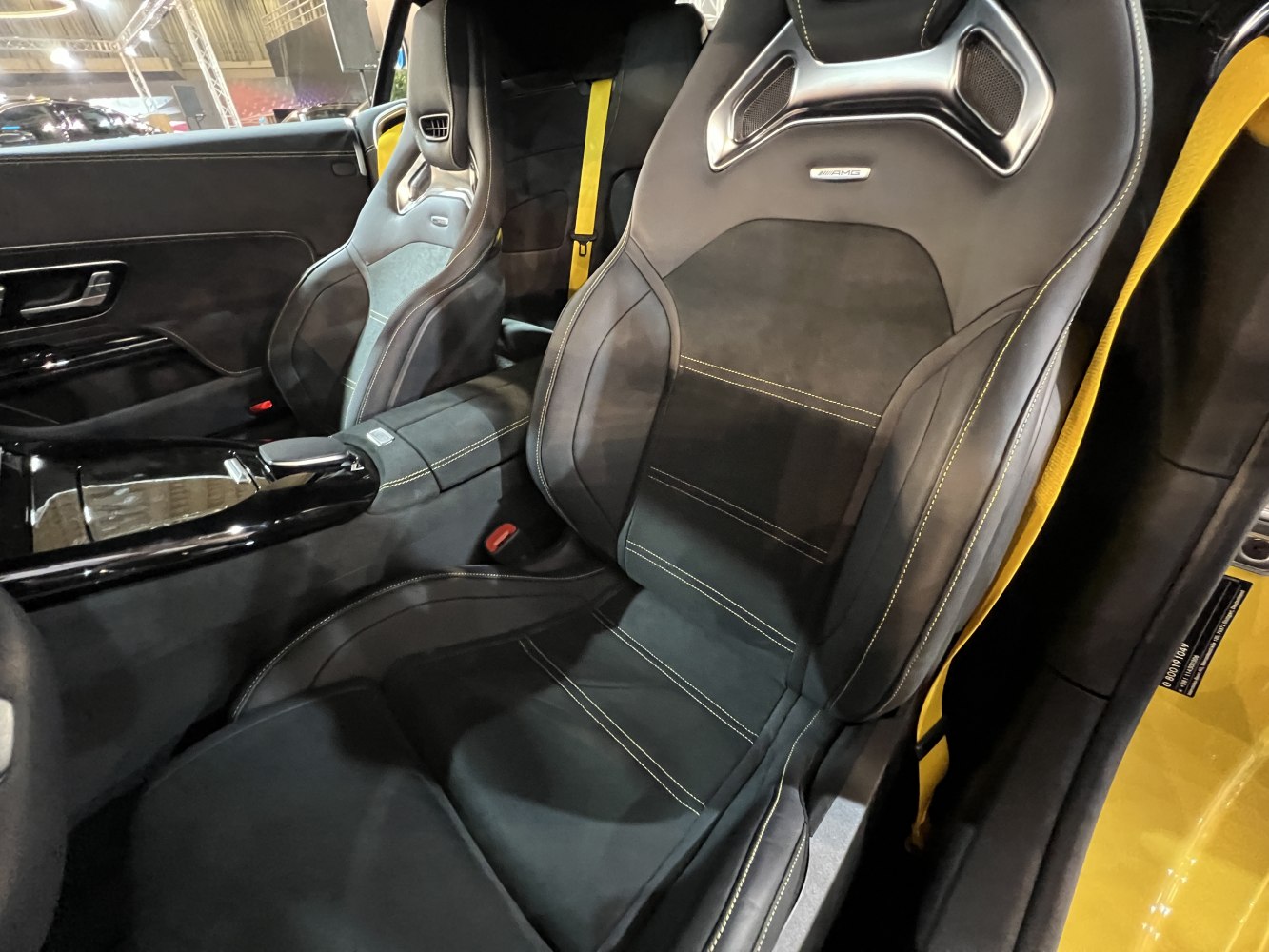 Black AMG sport seats with yellow stitching and premium design