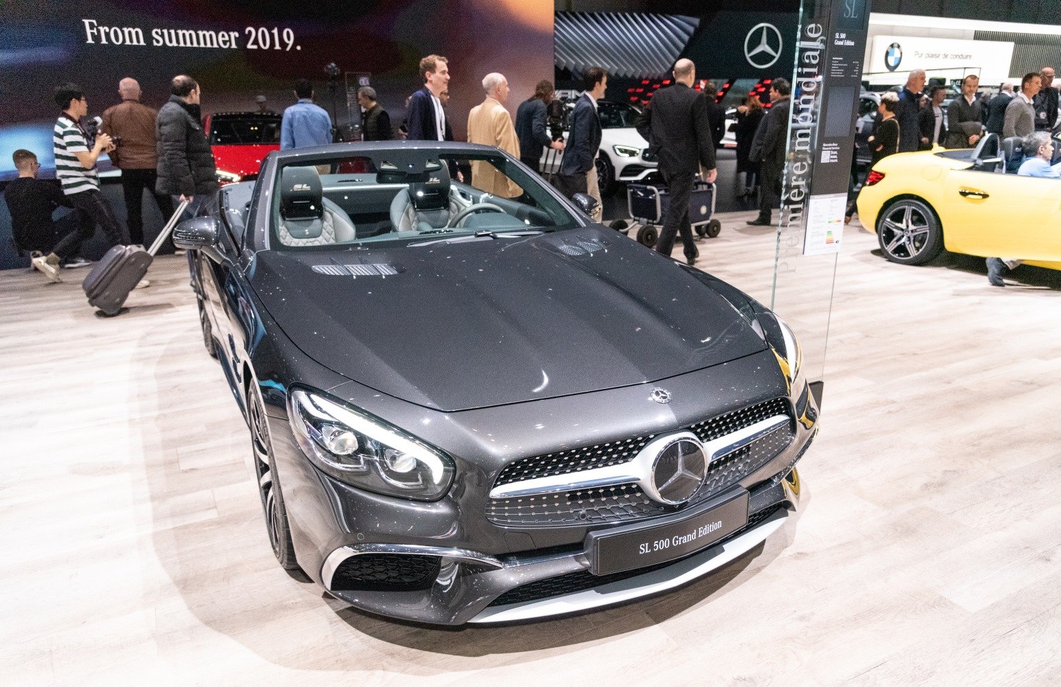 Luxury convertible with LED headlights and diamond grille.