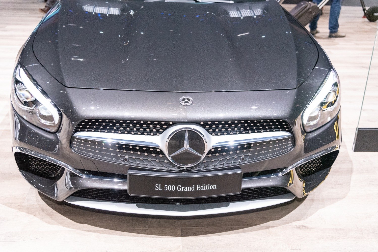 Close-up of front grille and headlights with chrome and LED details