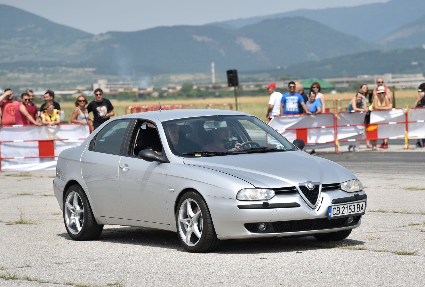 Silver sedan with distinctive grille and alloy wheels