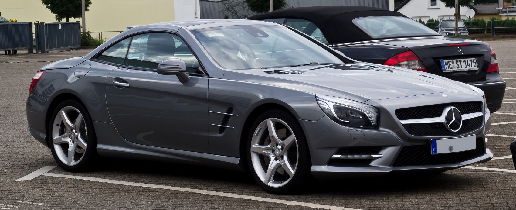 Luxury coupe with aerodynamic body and silver alloy wheels