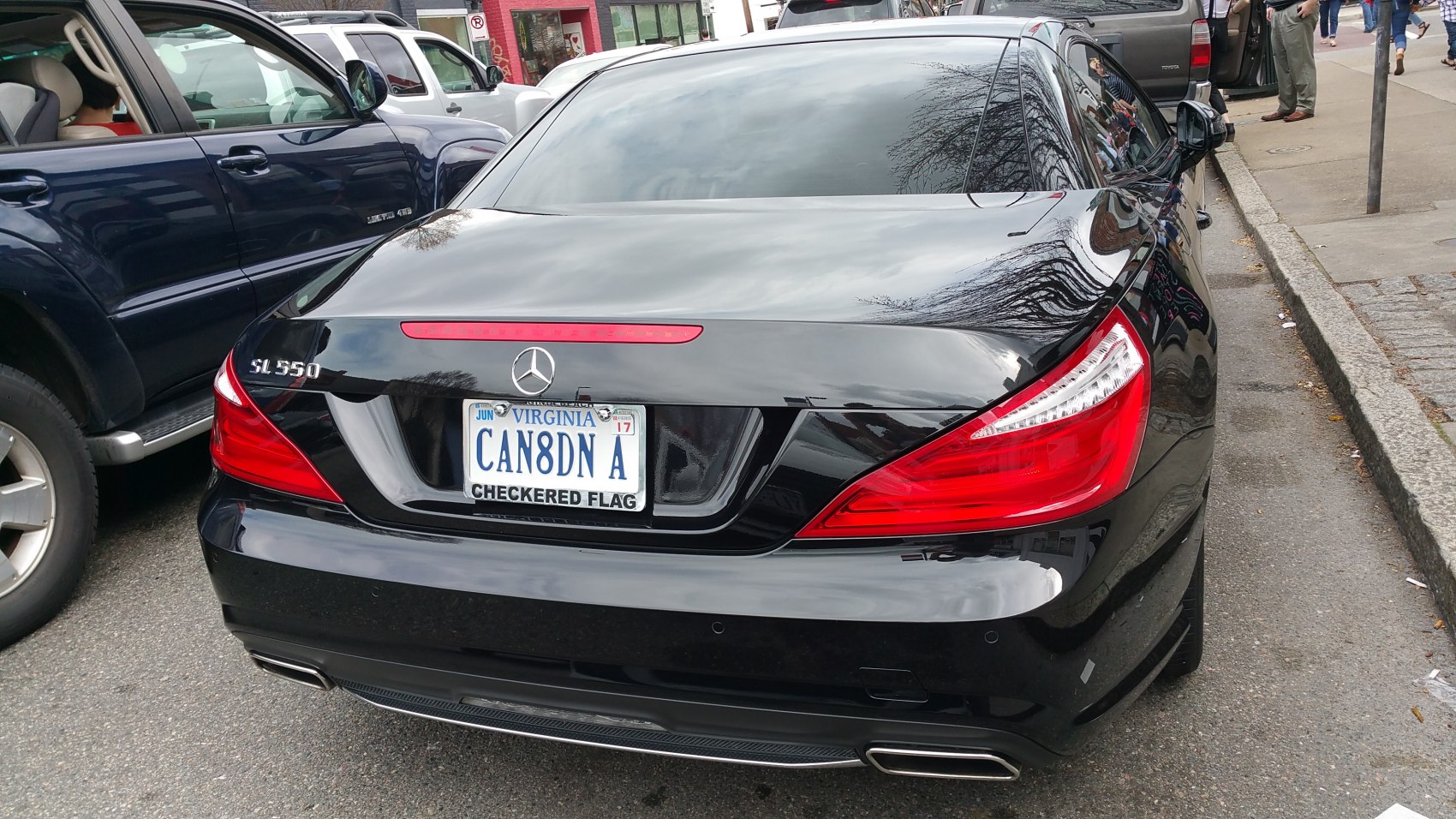 Rear view with distinctive tail lights and dual exhaust outlets