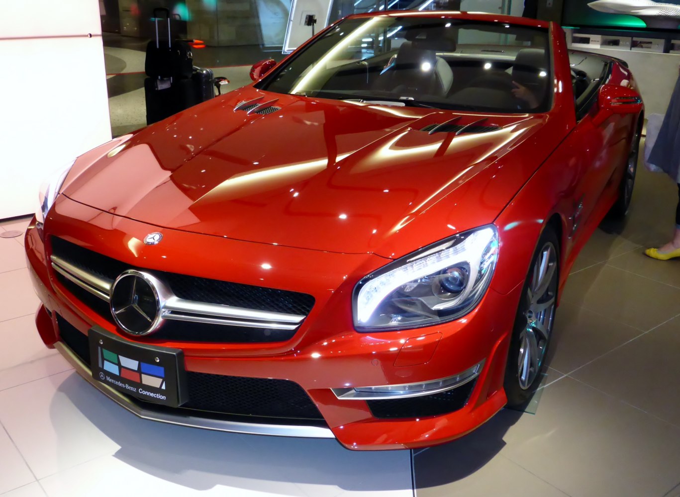 Red convertible with LED headlights and sporty hood vents