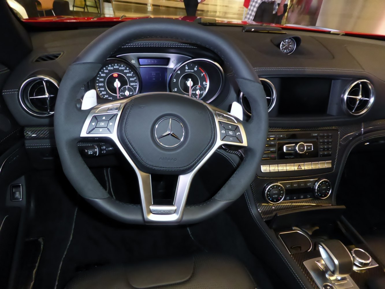 Multifunction steering wheel with instrument cluster and carbon fiber dashboard trim