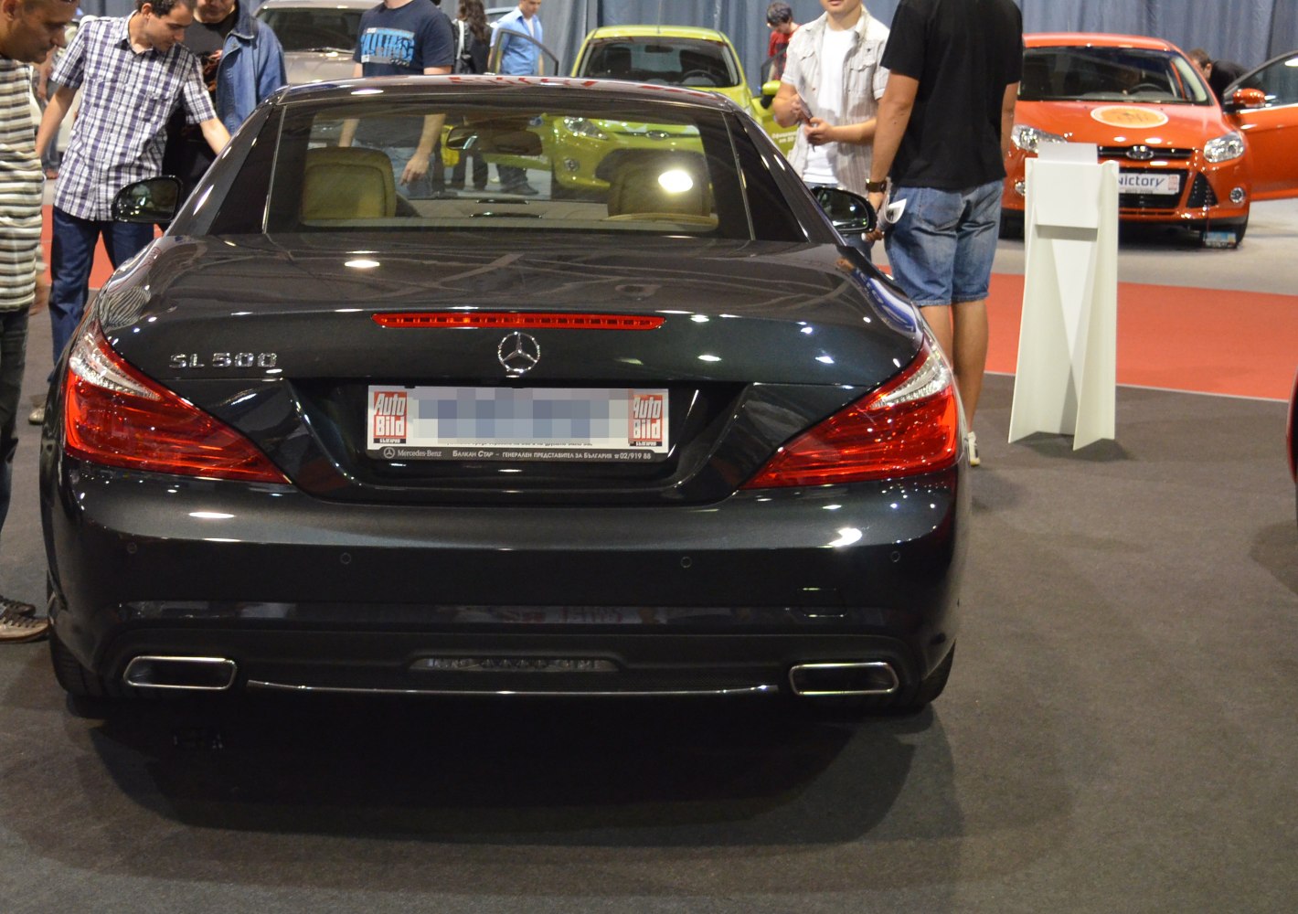 Rear view highlighting LED tail lights and dual rectangular exhaust tips